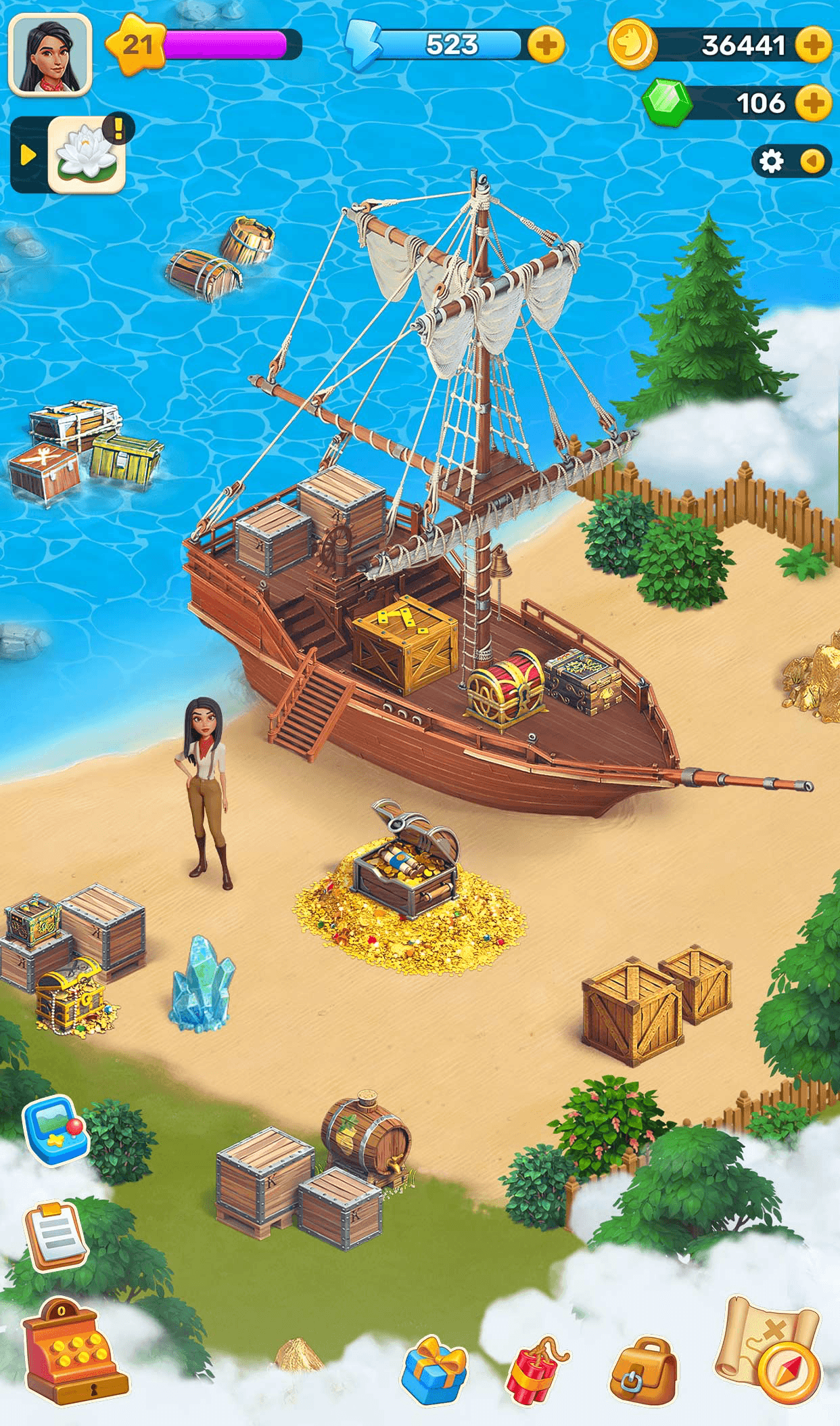 A Klondike expedition map, a wooden sailing ship beached on a sandy island with crates, barrels, a treasure chest and blue crystals around it, the explorer standing beside it and cloud covering the unexplored edges, with the level star of 21, an Energy bar reading 523, 36,441 coins and 106 Emeralds along the top